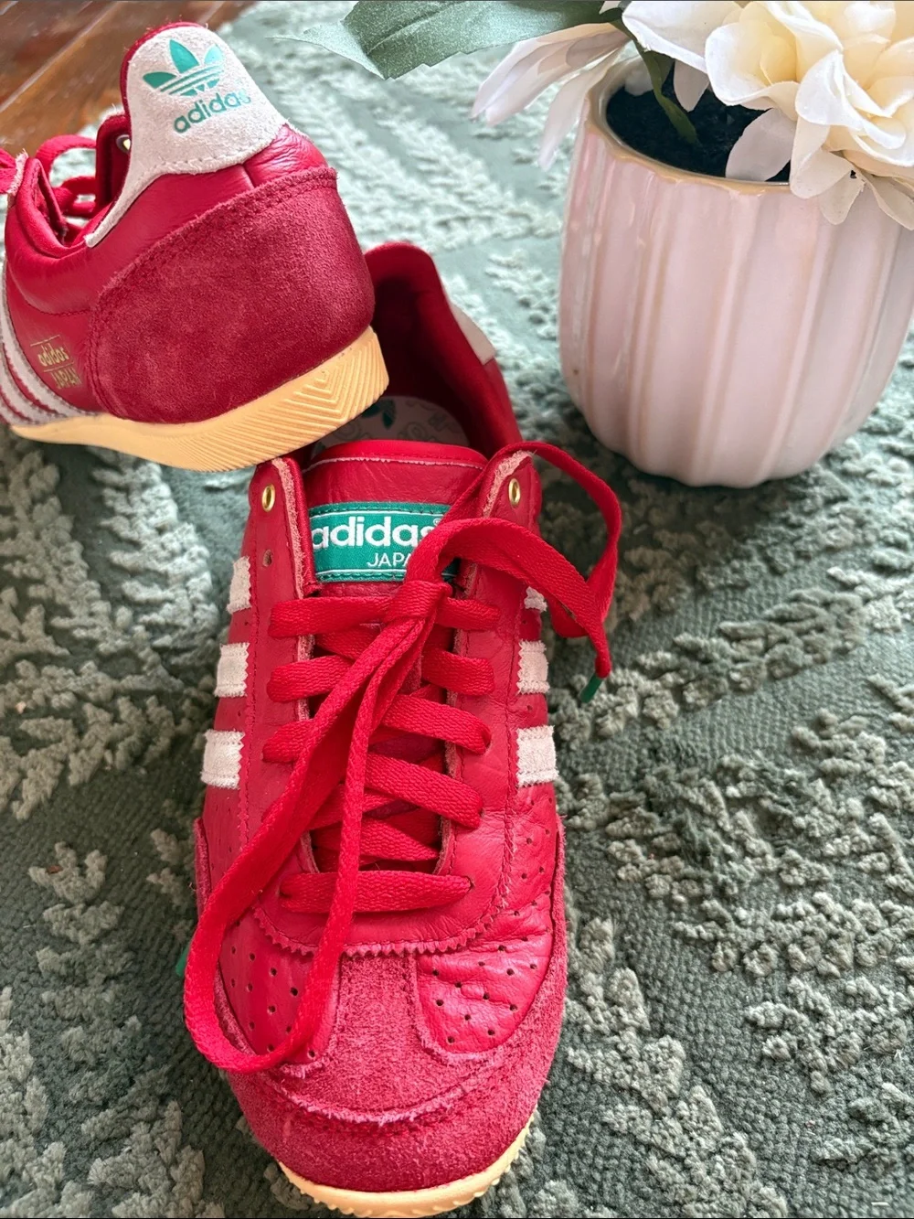 adidas women’s Red Sneakers with White Stripes